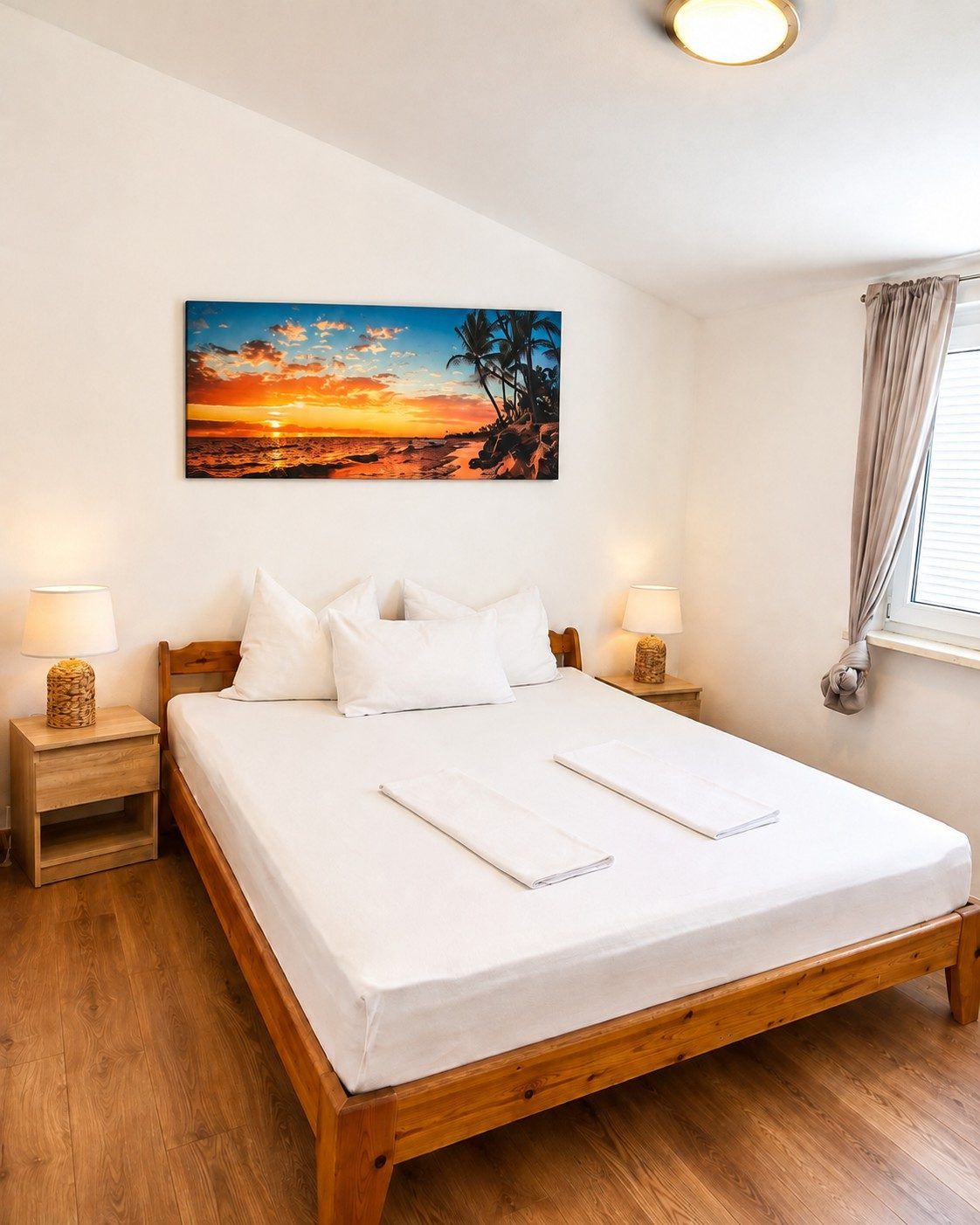 Bedroom with double bed and warm bedside lamps