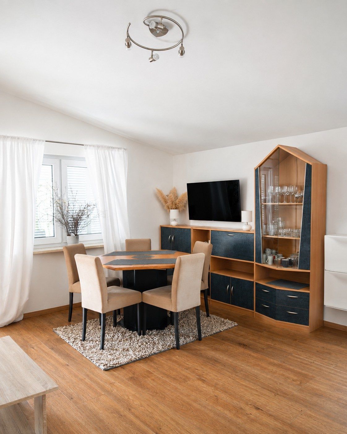 Dining table and media wall in the living room