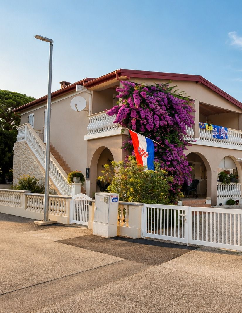 The Zelic family house on Vir with a large purple bougainvillea